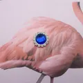 Sparkling round jewelry button featuring a deep blue center gem and white rhinestones - Sapphire Blue