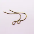 Macro shot of bronze DIY French ear hooks with small rings for jewelry making - Antique Bronze