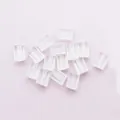 Cierres de silicona transparentes para pendientes sobre tela de color púrpura - Pendientes Y Sombreros Octogonales