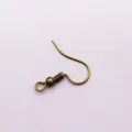 Macro detail of antique bronze fish hook earrings with spring coil and bead connector - Antique Bronze