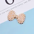 Detailed close-up of a pearl-studded bow accessory with small crystals on a gold base - Bowknot Pearl (Gold) / Bowknot Pearl (Gold Base)