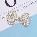 Close-up of a silver bow-shaped jewelry accessory with sparkling crystal rhinestones - Bowknot Rhinestone (Silver Base)