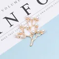 Detailed view of leaf branch jewelry charm featuring gold alloy and white pearls - 5mm Pearl Leaf / Gold