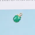 Detail eines grünen Muschelanhängers mit Vergoldung und Glitzer für DIY-Schmuck - Grün