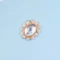 Macro shot of oval crystal button with gold alloy base for DIY hair accessory making - Transparent Style / White