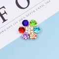 Macro view of flower alloy accessory with colorful rhinestones and gold-plated base - Mixed Colors