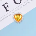 Elegant heart-shaped yellow gemstone accessory with sparkling white crystal border - Yellow