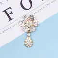 Accessorio a fiore in lega dorata con strass scintillanti e cristallo centrale arcobaleno - Ciondolo Fiore di Prugno (Oro) / Oro