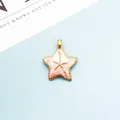 Macro detail of pink starfish charm with golden borders for DIY jewelry making - Pink