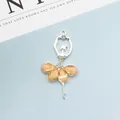 Ballerina pendant with crystal rhinestones and orange flower skirt in silver finish - Champagne (Silver Base)