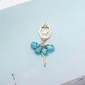 Golden ballet dancer charm with blue crystals and sparkling rhinestone accents - Light Blue (Gold Base)