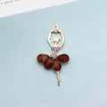 Golden ballet girl charm with dark brown crystal skirt and sparkling rhinestones - Coffee (Gold Base)