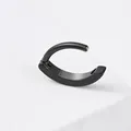 Detailed macro view of black polished stainless steel hinged segment belly ring jewelry - Black