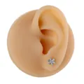 Elegant six-petal flower stud earring with micro-pave zircons on a model's ear - Flower Shape (B1372) / Silver
