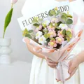 Close-up of handmade crochet daisy bouquet with pink and white flowers in gift wrapping - Large / Pink