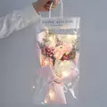 Pink and white soap rose bouquet with LED lights in a transparent gift bag with handle - Pink Rose Bouquet with Transparent Bag