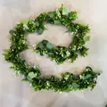 Artificial eucalyptus garland with lush green leaves and small white floral accents - Green and White Eucalyptus Style (RFG22001)