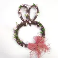 Detail of bunny head rattan wreath with pink cherry blossoms and a raffia bow - 33CM / Rabbit Ear Wreath