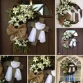 Easter floral wreath with wooden cross and white lilies on a rustic vine base - Easter Cross Door Hanging Wreath