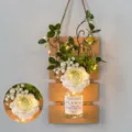 Hanging wooden wall planter with white artificial flowers and warm LED light string - Yellow Board with Song-like