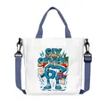 White canvas tote bag with festive 67 print, navy handles and adjustable crossbody strap - 07