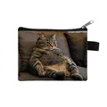 Mini cat coin purse featuring a funny tabby cat print on a gray fabric sofa background - Tabby Cat Sofa Style (01)