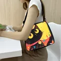 Black cat tote bag with artistic yellow and red illustration and adjustable strap - Art Cat Red Yellow BG (7)