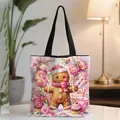 Christmas tote bag with gingerbread man illustration on a white table in cozy setting - Pink Gingerbread Man Watercolor Illustration (09)