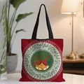 Festive red Christmas tote bag featuring a Ho Ho Ho wreath design with black handles - Red HoHoHo Festive Wreath (13)