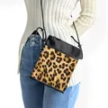 Leopard print crossbody bag for women with black stitching and adjustable rope strap - Black and Yellow Spliced Leopard