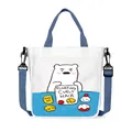 White canvas tote bag with cartoon polar bear print and blue adjustable shoulder strap - Duosha Style