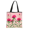 Pink floral tote bag with thistle pattern and black durable woven shoulder straps - Poppy