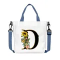 Borsa tote in tela bianca con lettera D floreale e tracolla blu regolabile - Lettera D(D04)