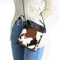 Brown and black cow print crossbody phone bag with black rope strap and zipper closure - Brown White Black Cow Print