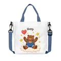 Borsa tote in tela bianco avorio con tracolla blu e stampa di orsetto felice - Stile Orso in Salopette Nuvola Happy (13)