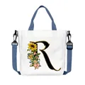 White canvas tote bag with floral letter R print and adjustable blue crossbody strap - Letter R(R18)