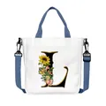 White canvas tote bag with floral letter L print and adjustable blue shoulder strap - Letter L(L12)