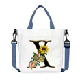 White canvas crossbody bag with sunflower letter X design and adjustable blue straps - Letter X(X24)