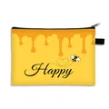 Dettaglio della borsa trucco ape con stampa miele giallo e manico con zip nera - Miele Happy Ape