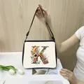 Minimalist tote bag with floral letter K print and adjustable black shoulder strap - K11 (Letter K)
