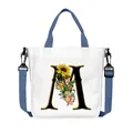 Borsa tote in tela bianca con lettera M a fiori e tracolla blu regolabile in tessuto - Lettera M(M13)
