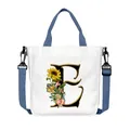 Borsa in tela bianca con lettera E e girasole con tracolla blu regolabile e removibile - Lettera E(E05)