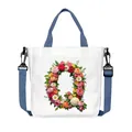 White canvas tote bag with floral letter Q, blue handles and adjustable shoulder strap - Flower Letter Q Style(17)