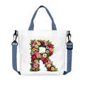 White canvas tote bag featuring floral letter R with adjustable navy shoulder straps - Flower Letter R Style(18)