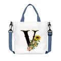 Borsa in tela bianca con lettera V, stampa girasole e tracolla blu regolabile - Lettera V(V22)