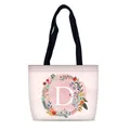 Pink canvas tote bag with letter D and floral print in a minimalist fashion design - Letter D Style