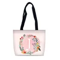 Pink canvas tote bag with floral letter J print and black handles for travel - Style J