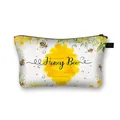 Floral Honey Bee cosmetic bag with yellow honeycomb pattern and secure zipper closure - Honey Bee with Honeycomb Pattern
