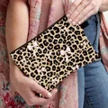 Leopard print makeup bag with pink bow pattern featuring a top zipper and side handle - Leopard Print All-over Pink Bow Tie Style (05)