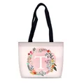 Pink gradient canvas tote bag featuring floral wreath and white letter T design - Style T